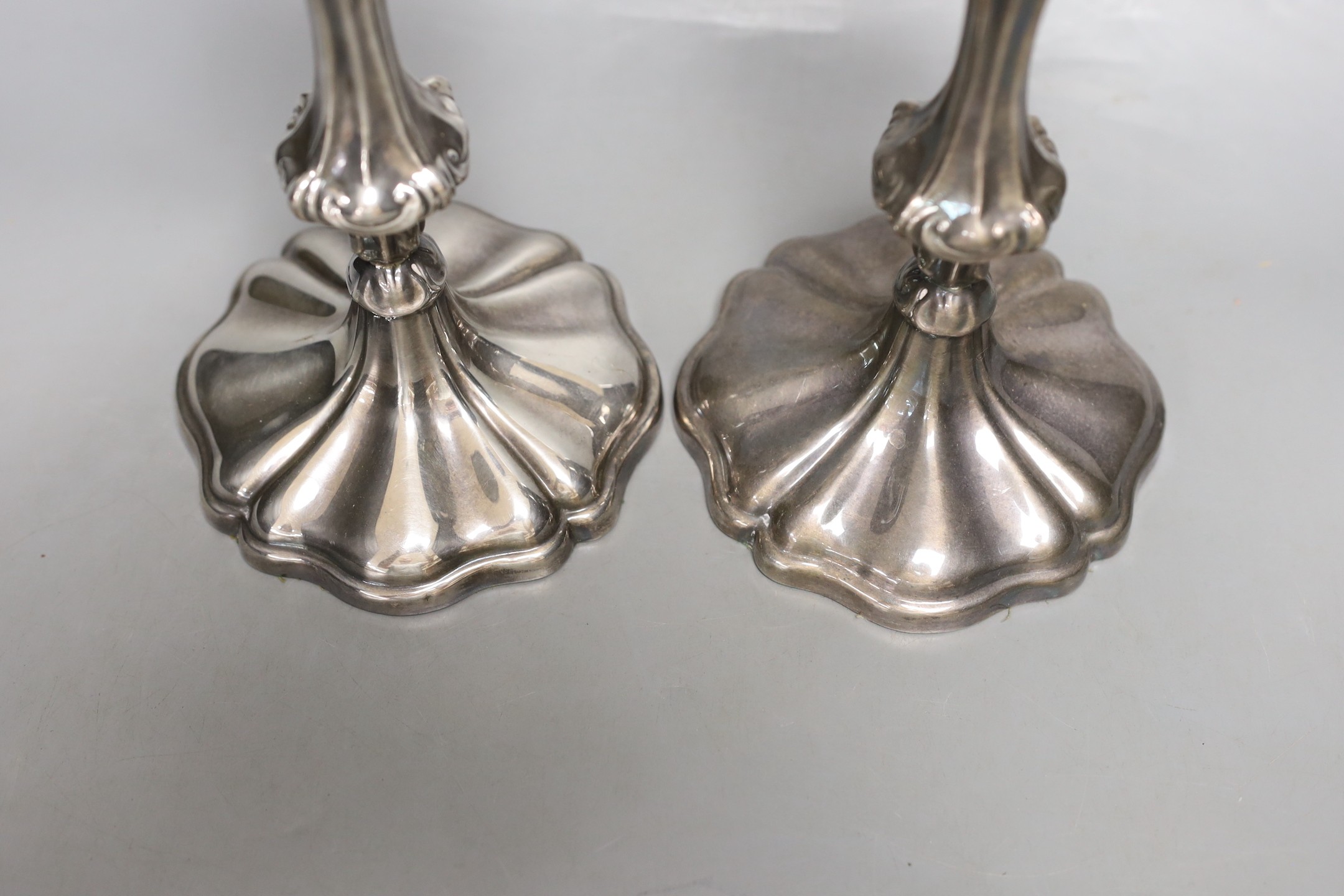 A pair of Rococo-style plated candlesticks - 24cm tall
